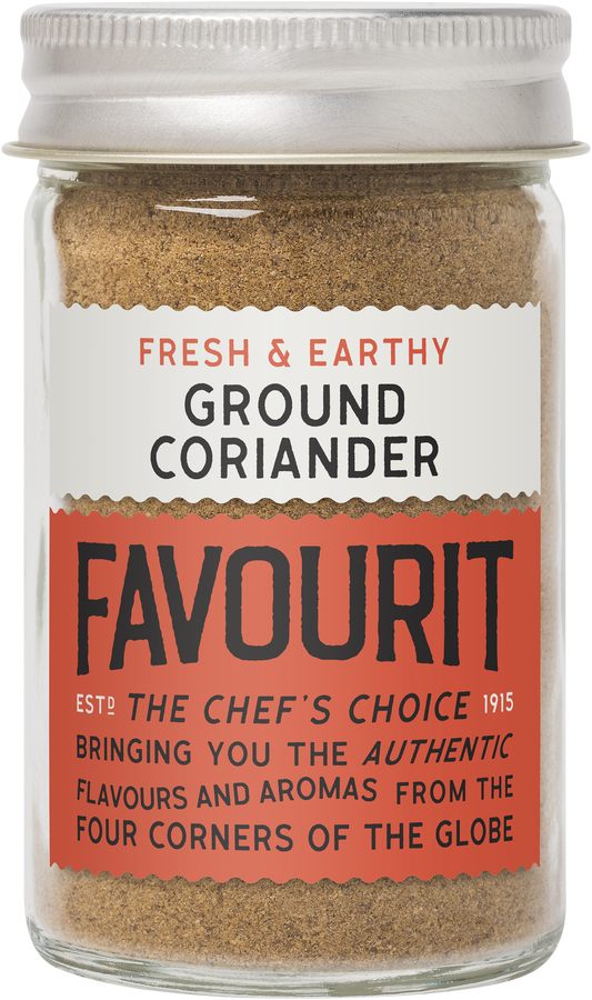 A glass jar of ground coriander by Favorit with a label stating "Fresh & Earthy" and "The Chef's Choice 1915". The label highlights "authentic flavors from the four corners of the globe".